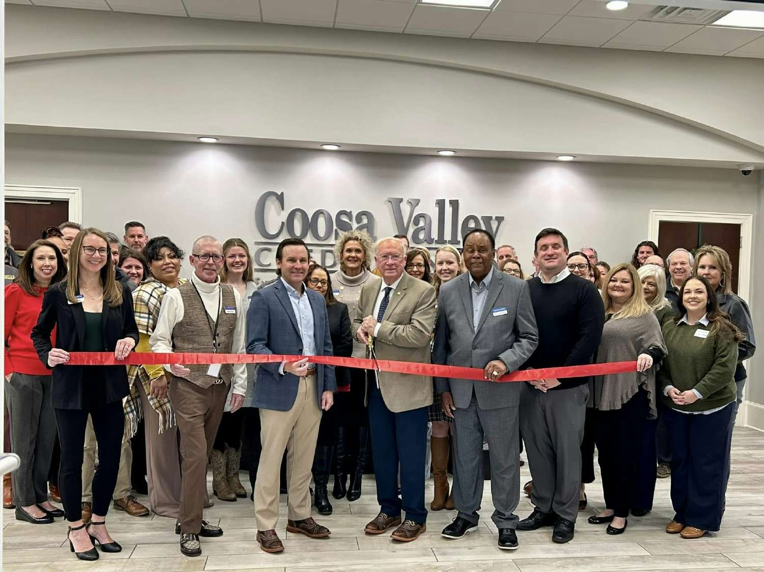 Employees join board members, chamber of commerce and members to celebrate opening of new Canton location.