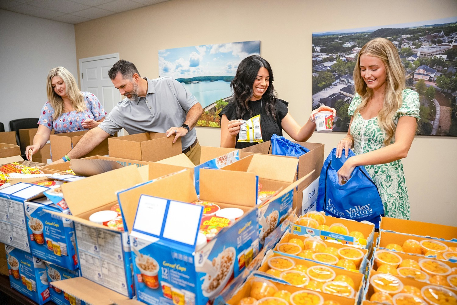 Employees packing food donations.