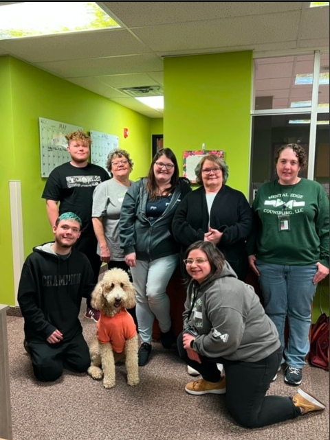 Front Line staff with Whisper The Therapy Doodle