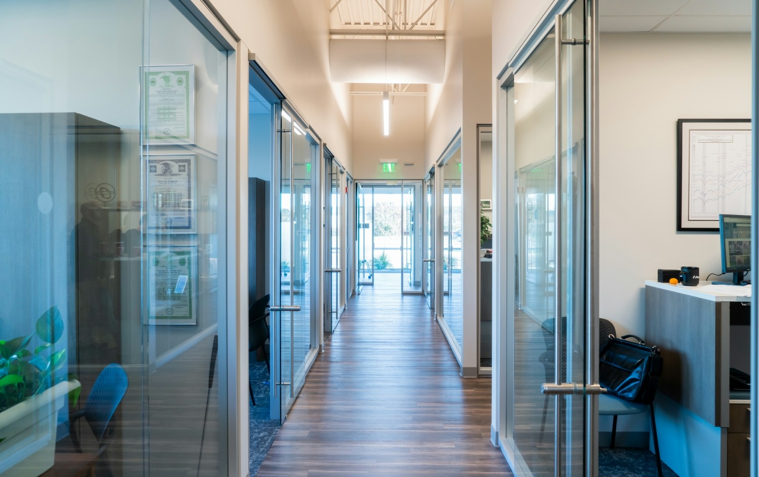 Looking down the hallway of our new office space - open spaces, natural light and modern finishes.