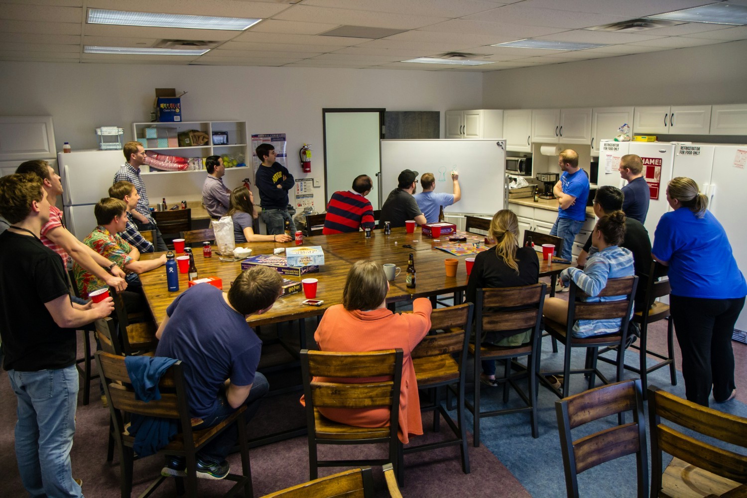 Playing Pictionary on a company fun day. 