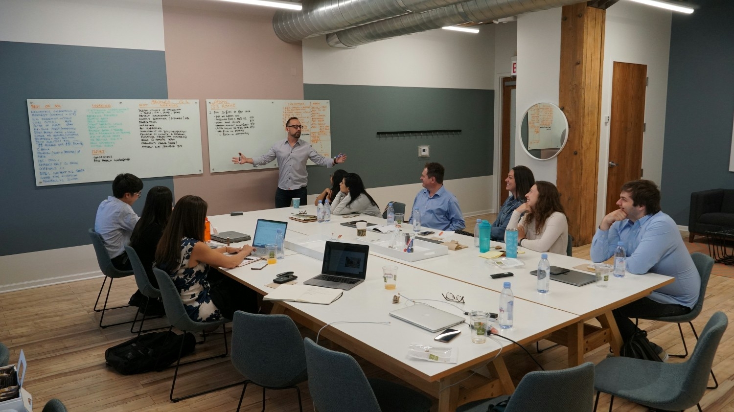 The Arcalea team gathers around the table for an organizational offsite planning session.