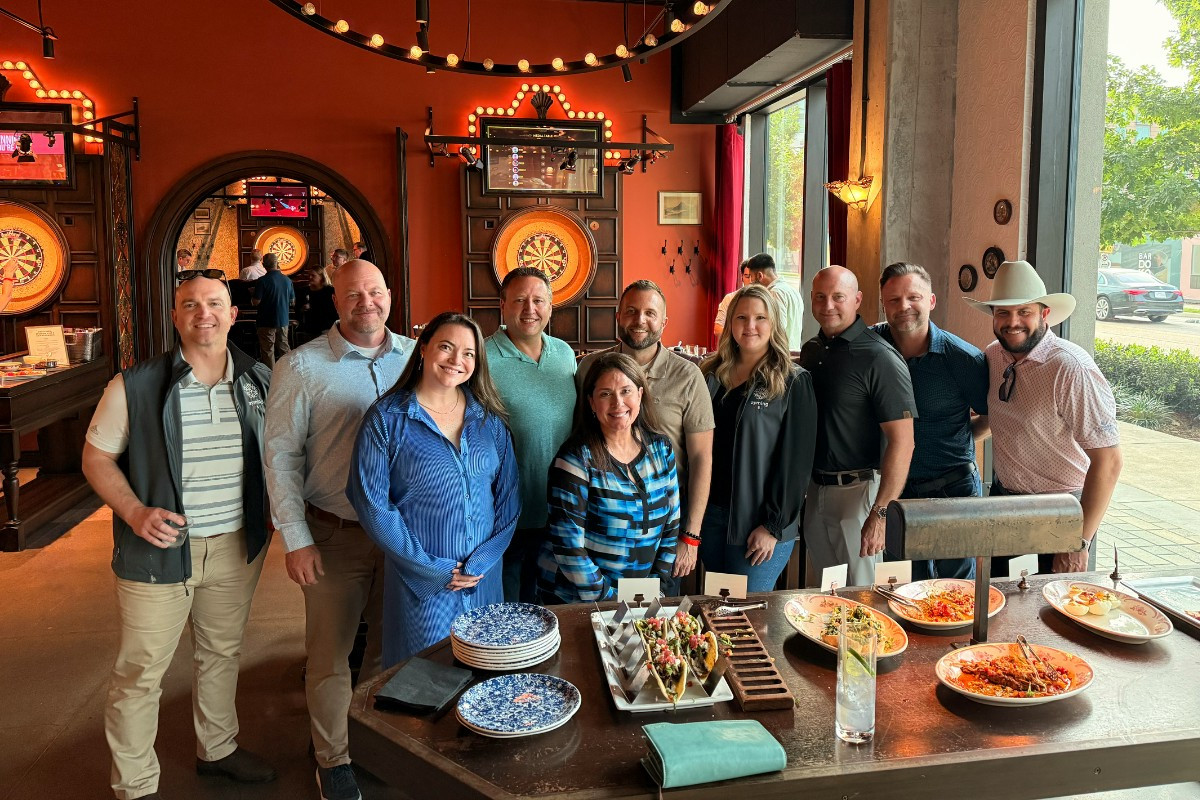Team building at Flight Club Houston, playing darts while enjoying together time outside of the office.