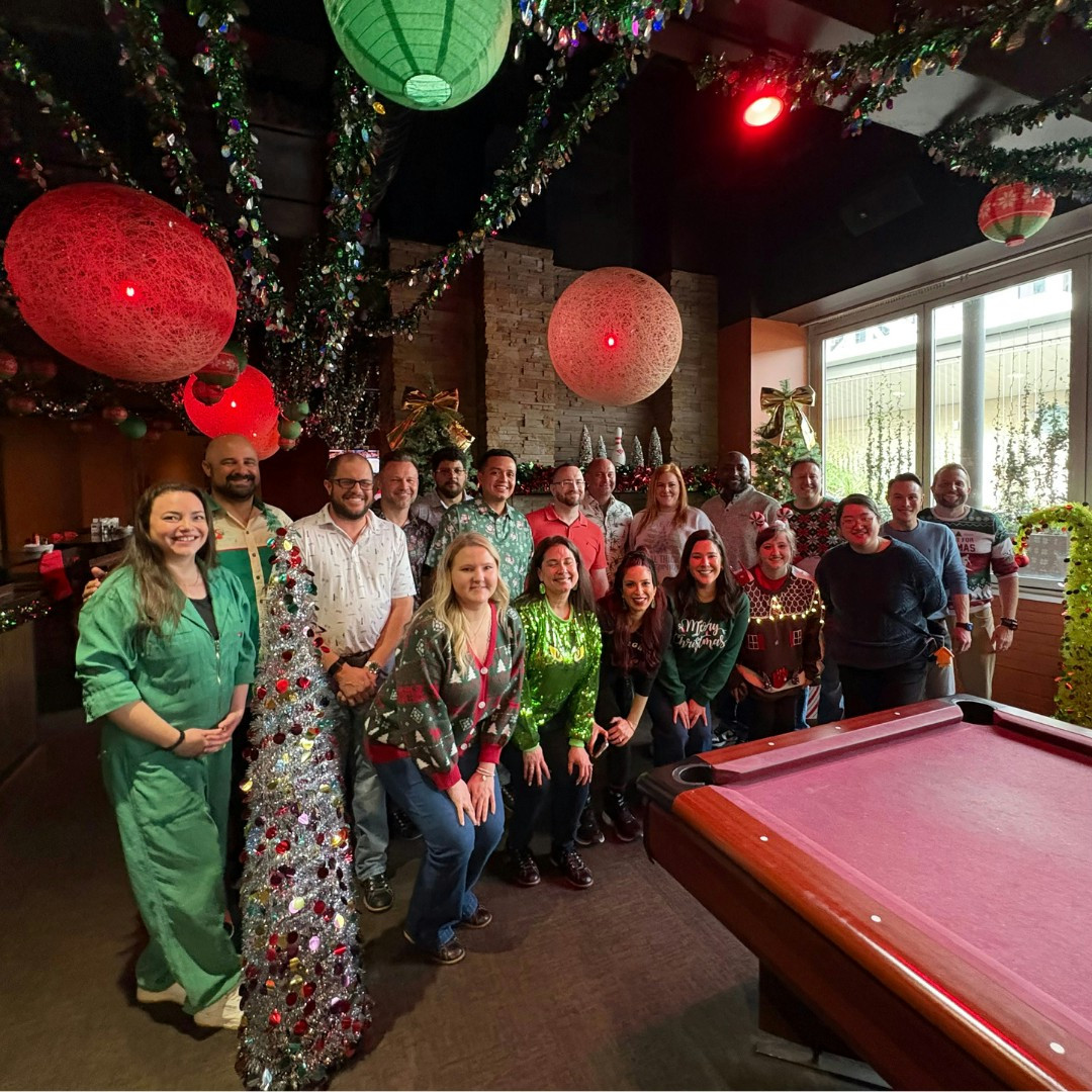 Gathering for a holiday party wearing our festive attire, enjoying bowling and a fun gift exchange.
