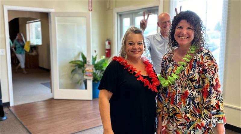 Community Link Consulting's Billing Department Director, HR Manager, and Founder at a luau-themed potluck.