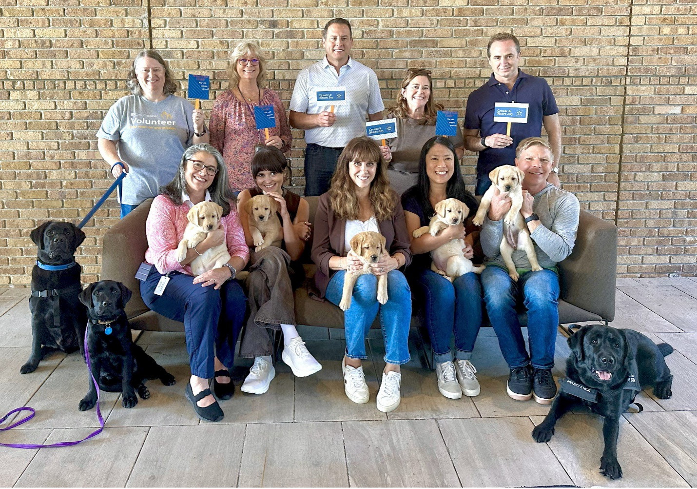LPL partners with nonprofit Project 2 Heal, who trains puppies to become service dogs for individuals with disabilities.