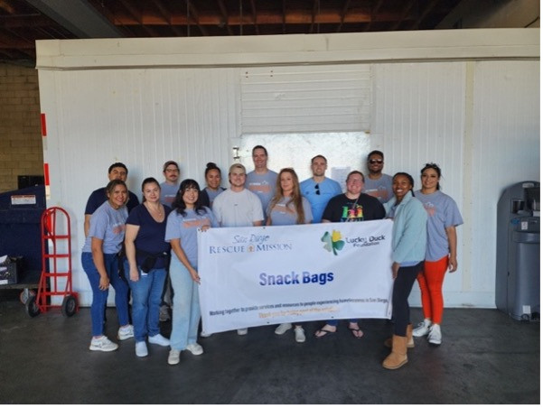 LPL's Young Professionals ERG volunteering with the San Diego Rescue Mission, creating lunch bags for those in need.