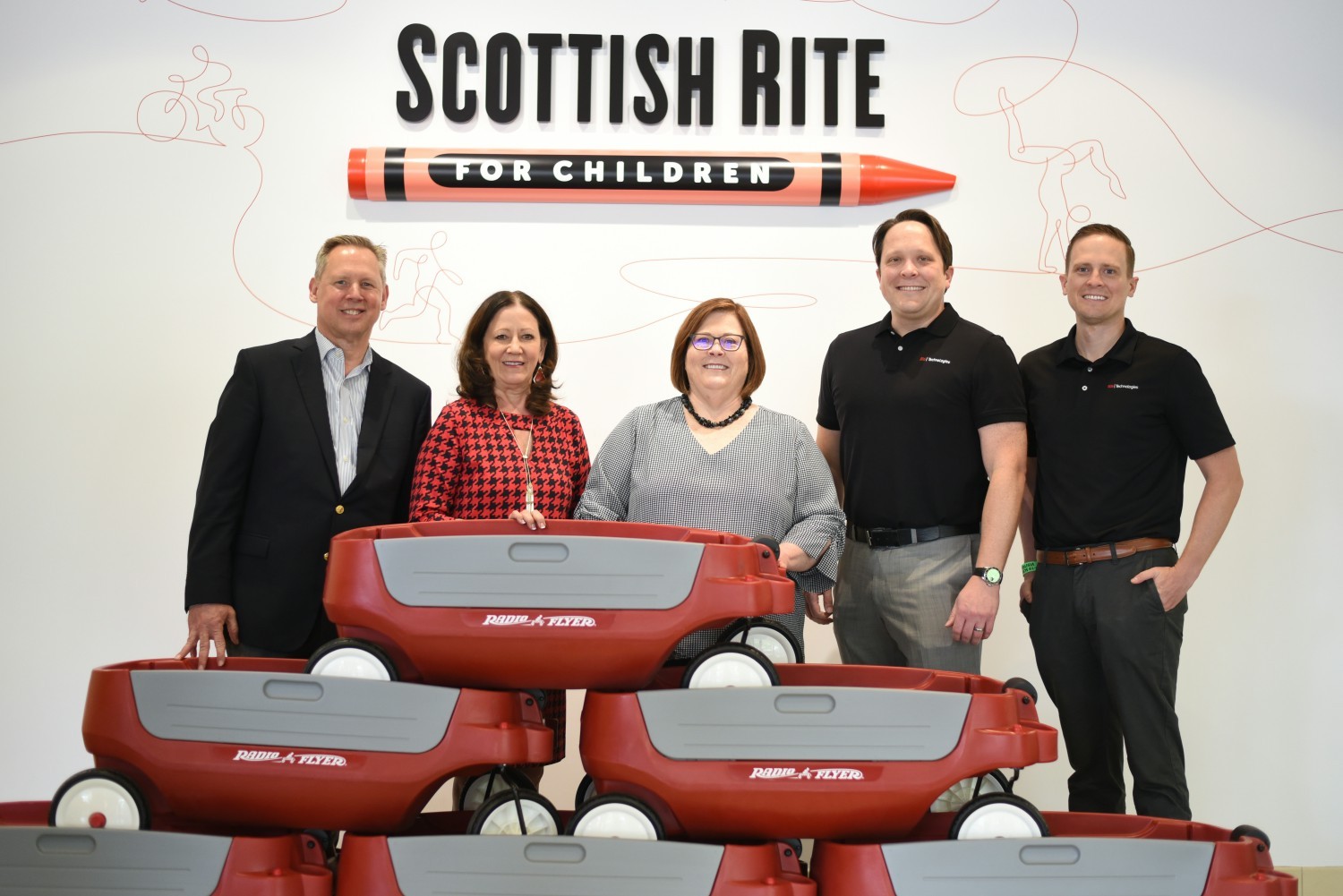 806 Technologies leadership presenting gift of wagons, blankets, and stuffed animals to Scottish Rite Spring of 2022. 