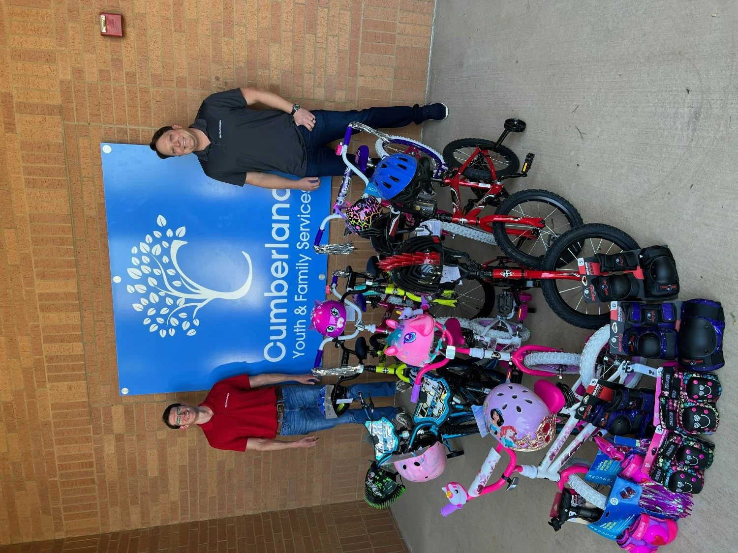806 Technologies CEO & CIO with bikes donated to support youth in North Texas —building brighter futures together!