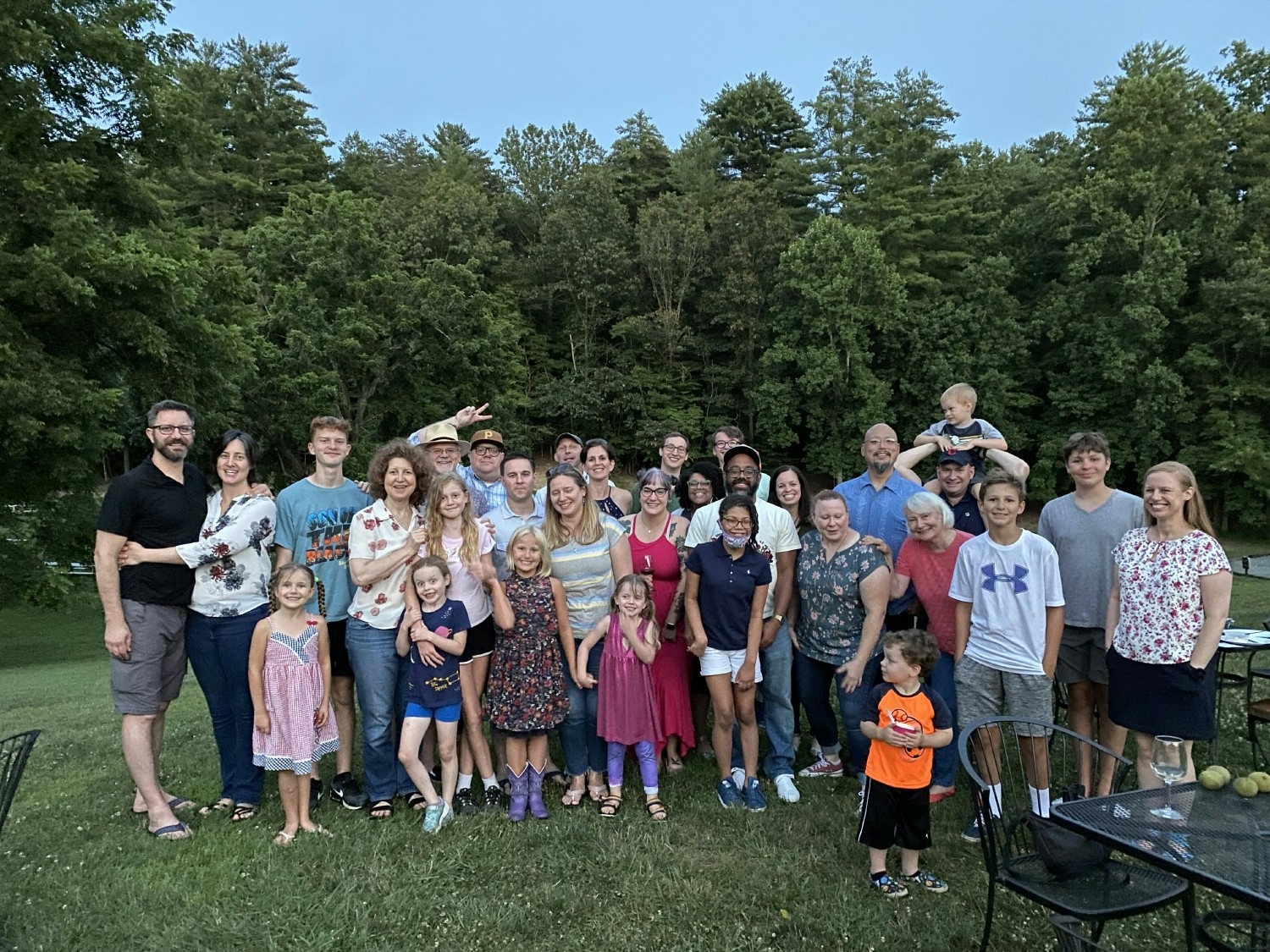 The Cerberus team and their families at a summer outdoor movie night event.