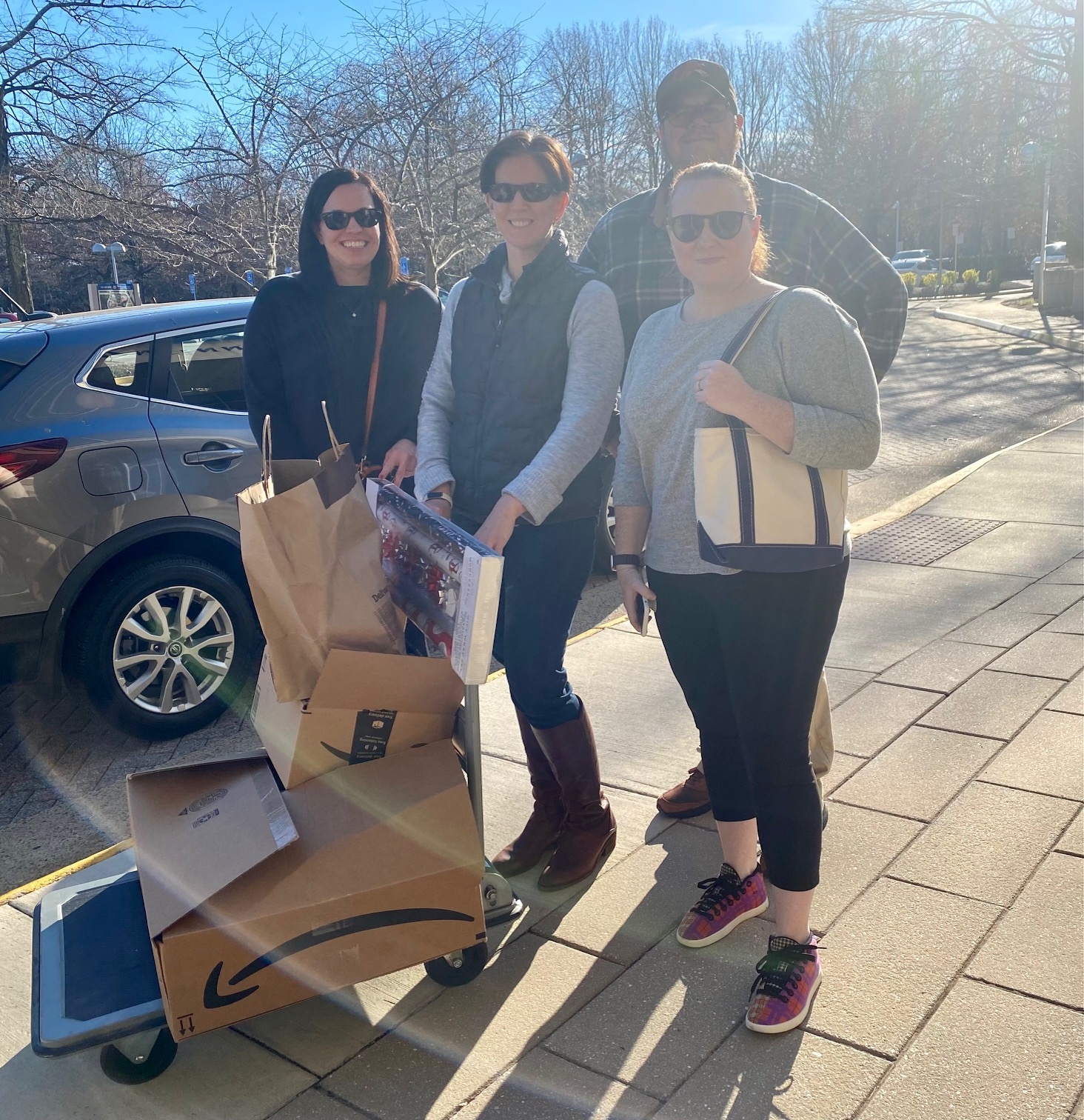 The Good Citizenship Committee delivering holiday gifts to our adopted family.