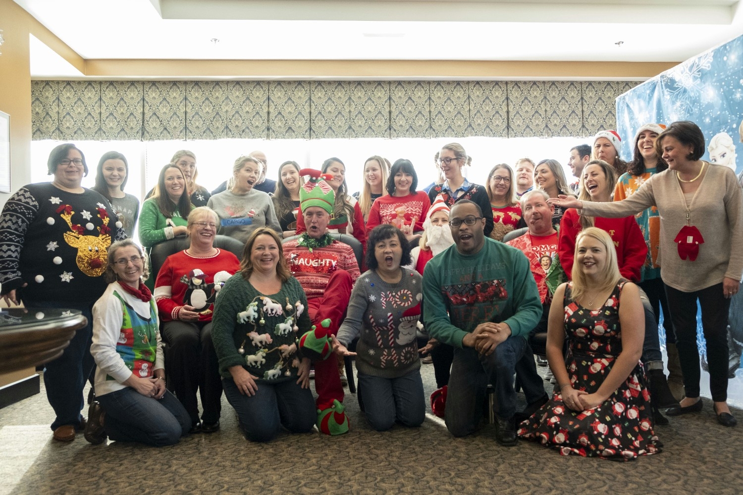 Falvey Insurance Group employees donning their favorite ugly sweaters during a week of internal company meetings. 