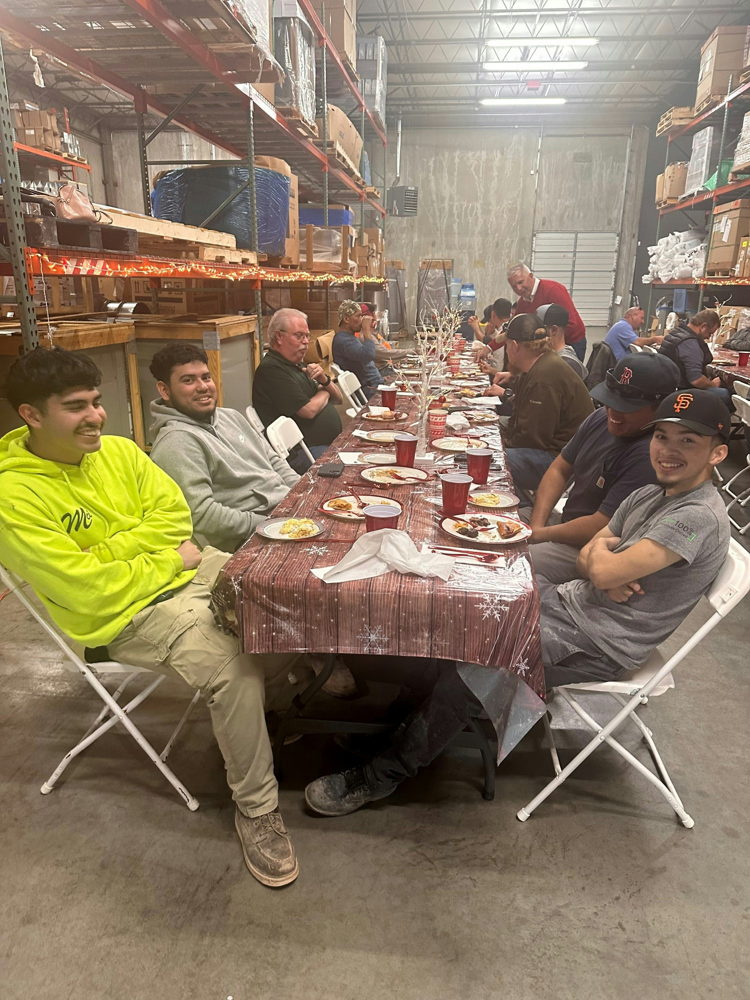 Service Techs taking a break in the shade; service mentorship programs allow apprentices to fast-track their education. 