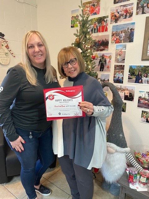 Presenting the Placer Food Bank with a donation from our annual Pay it Forward campaign, along with notes from the Team.