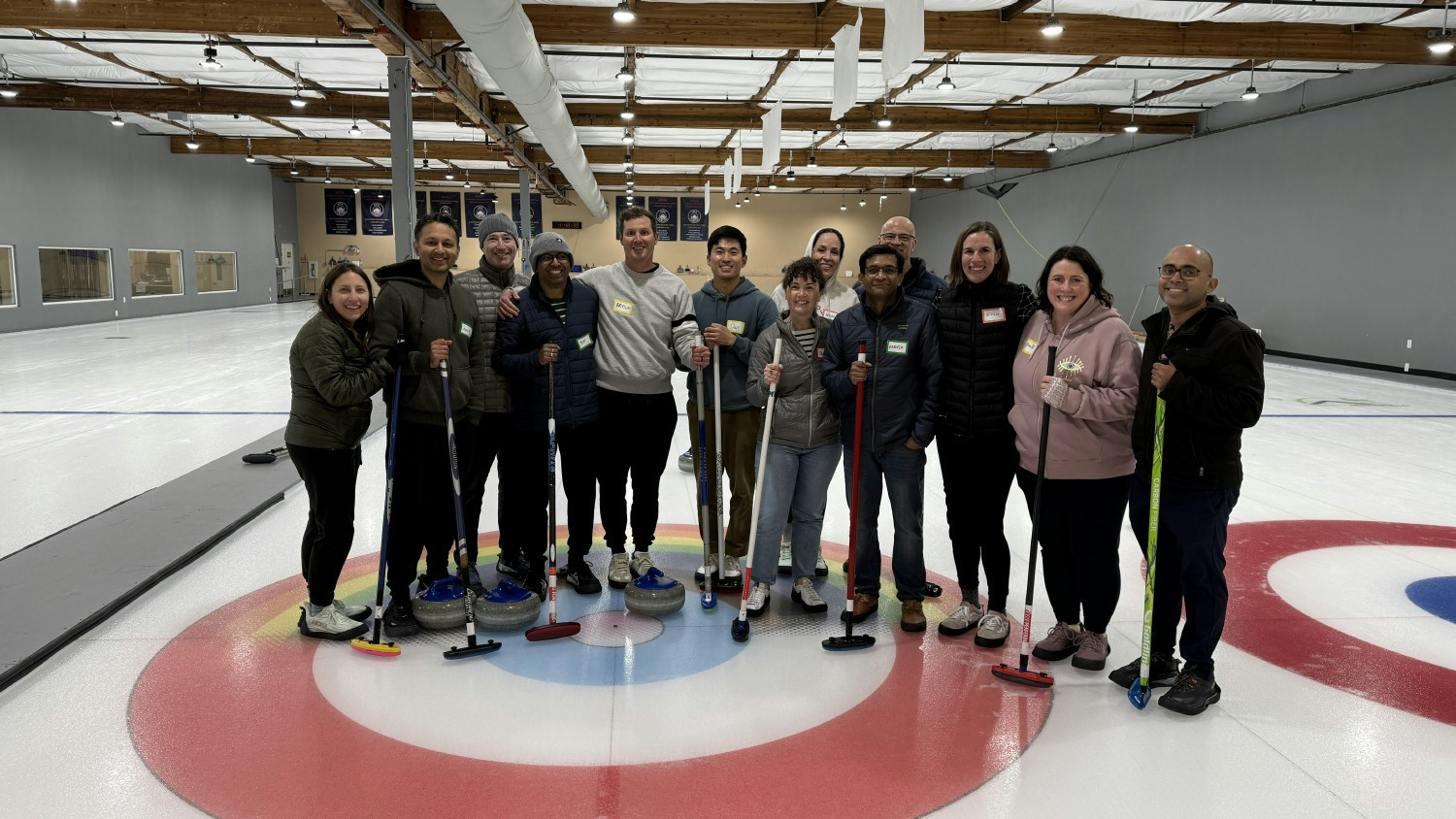 Trading boardrooms for the rink, our leadership team bonding over curling and a little friendly competition 🥌