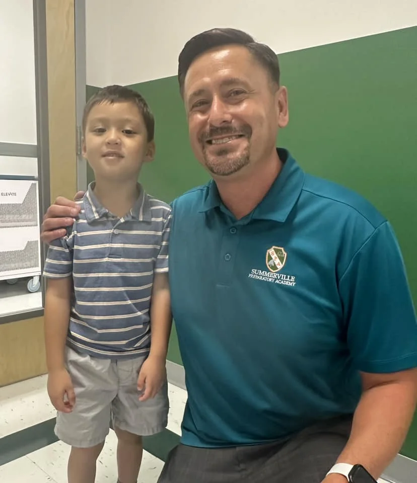 Principal, Dr. Tony Wilson is all smiles with a new student at our new school, Summerville Preparatory Academy, in SC.