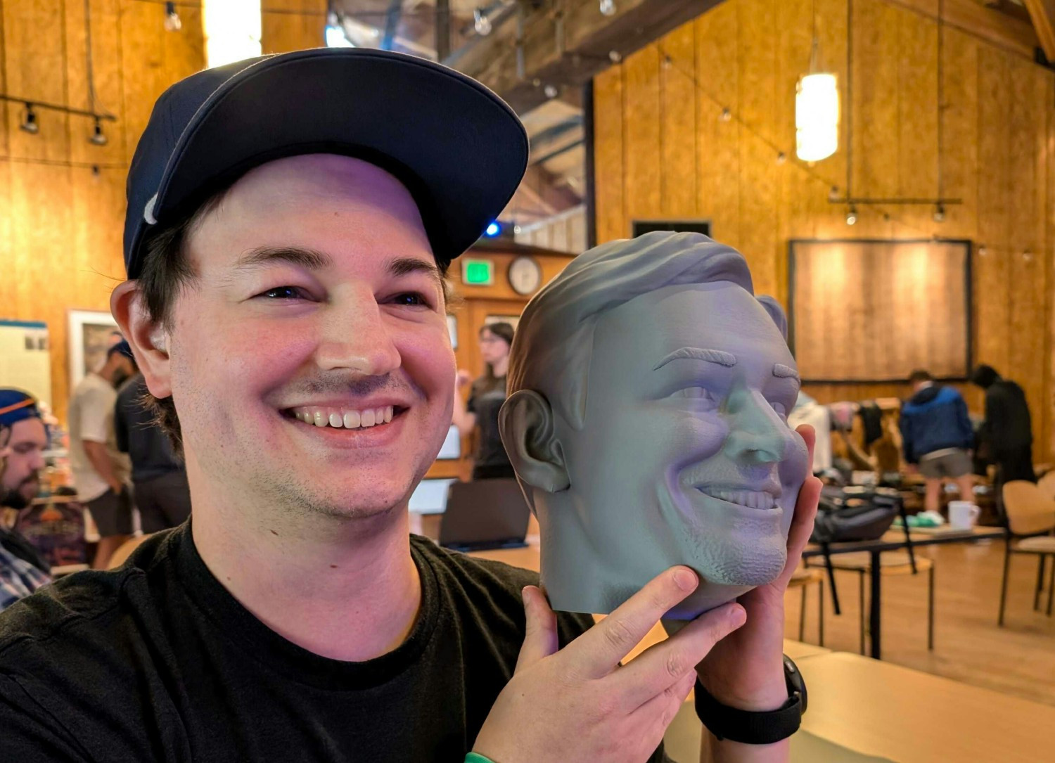 One of Gamesight's Software Engineers and most tenured team members, with an anniversary gift: a replica of his head.