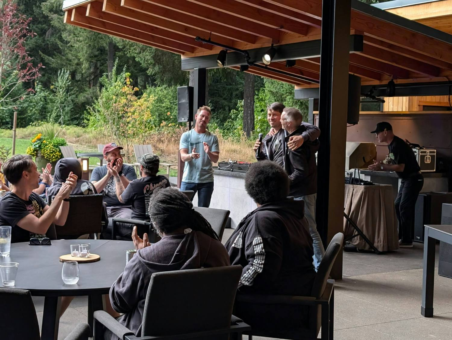 Executive leaders speaking to the team at our company retreat.