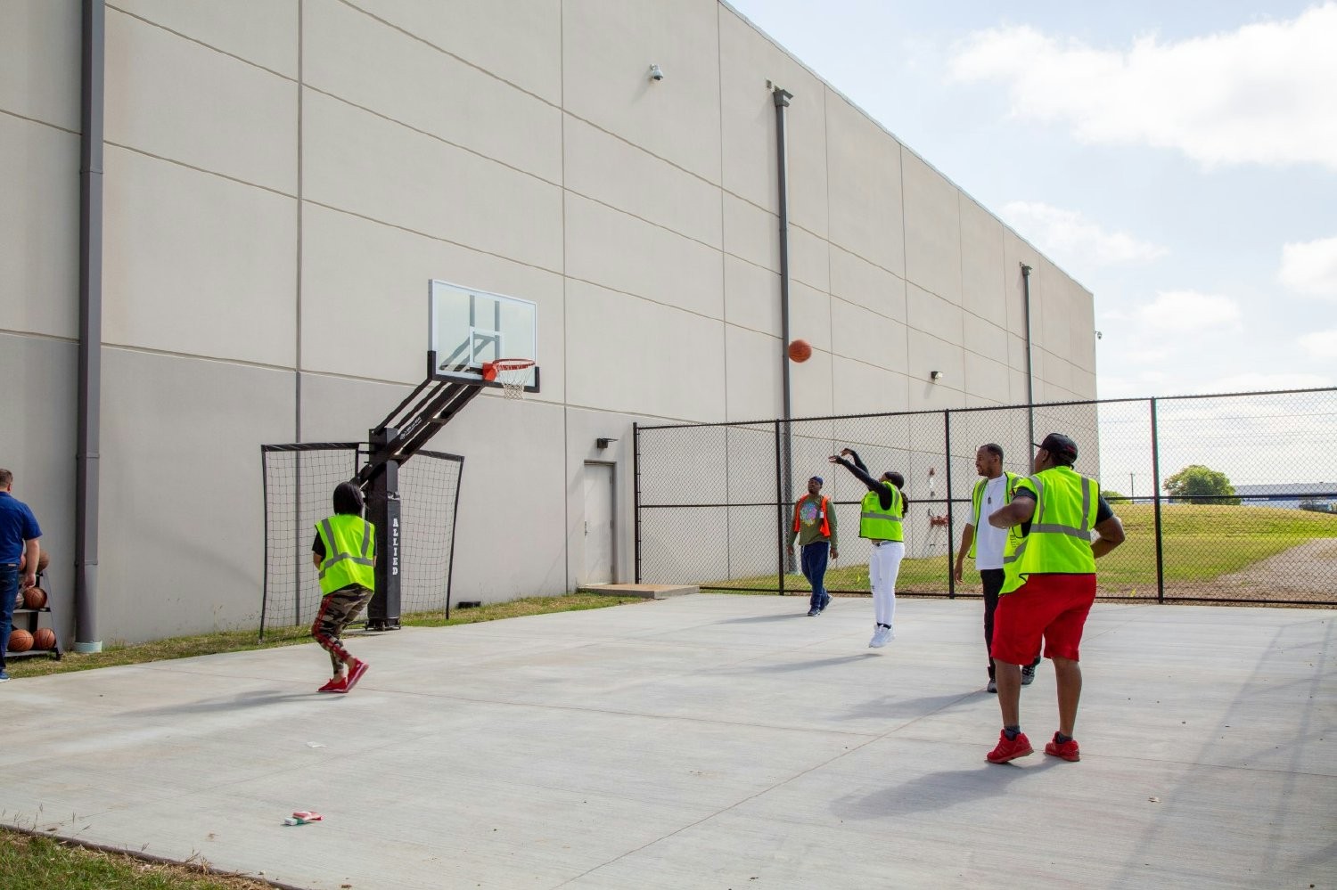 Allied Electronics & Automation employees taking a break in the new basketball court at the hybrid office in Dallas-Fort Worth