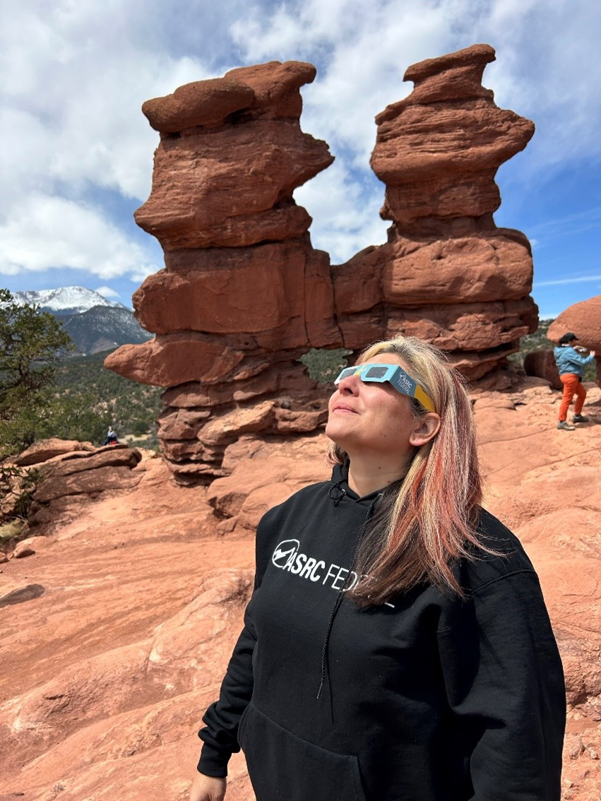 An employee participating in an engagement activity during the 2024 solar eclipse.
