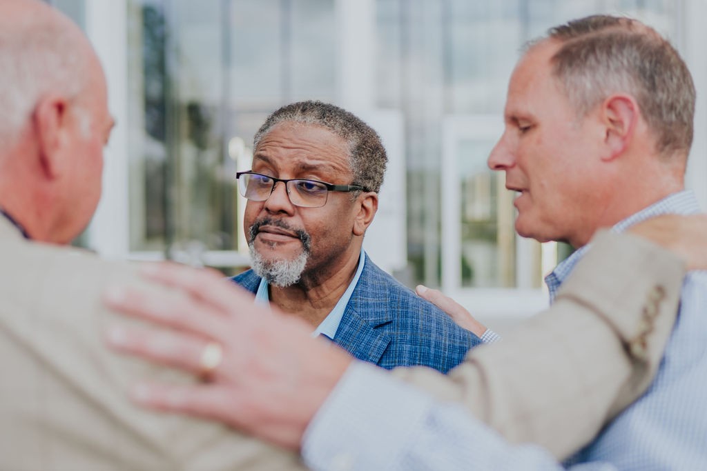 The Tridius Technologies team having conversations during the Plano, TX office opening.