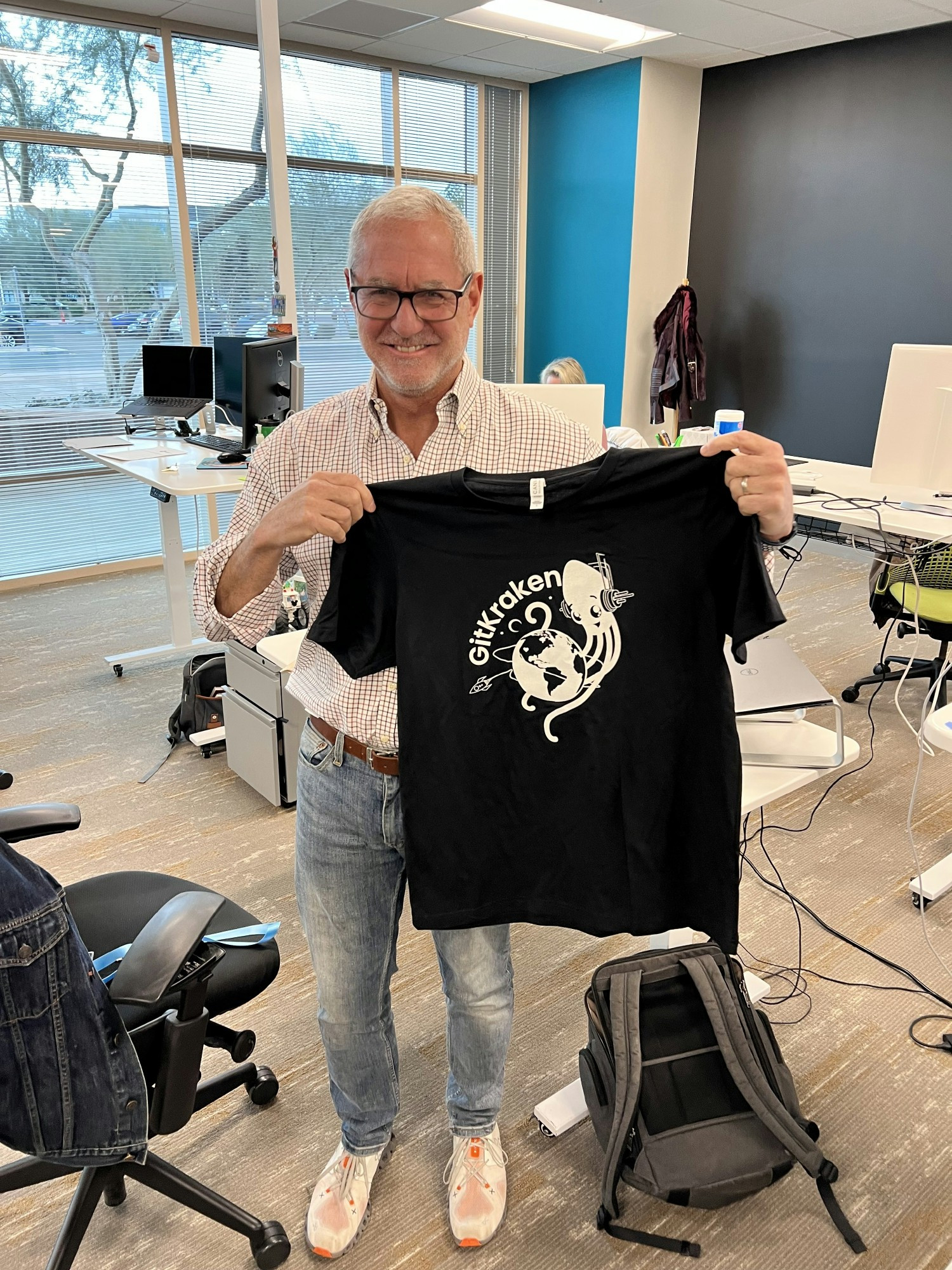 New swag! Our CFO showing off our new t-shirts