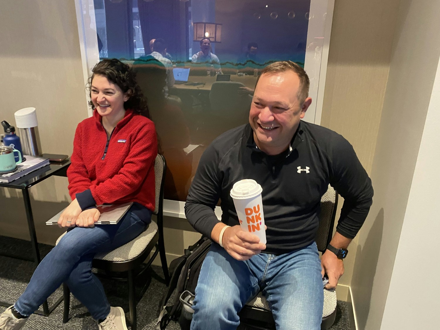 Two members of the Sprocket Sports Technology Team have fun during a meeting while staying caffeinated.