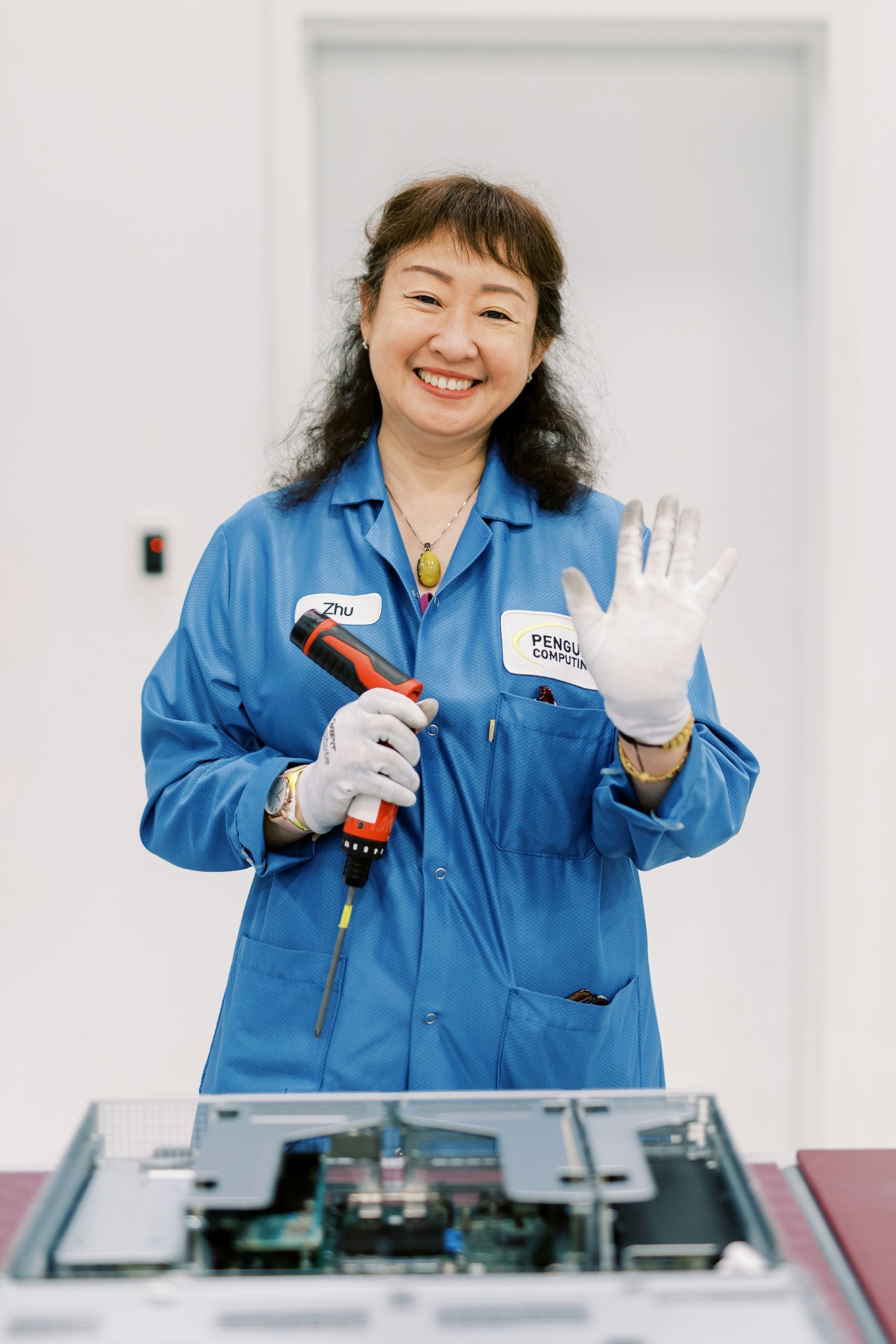 Penguin Solutions employee assembling a server unit.