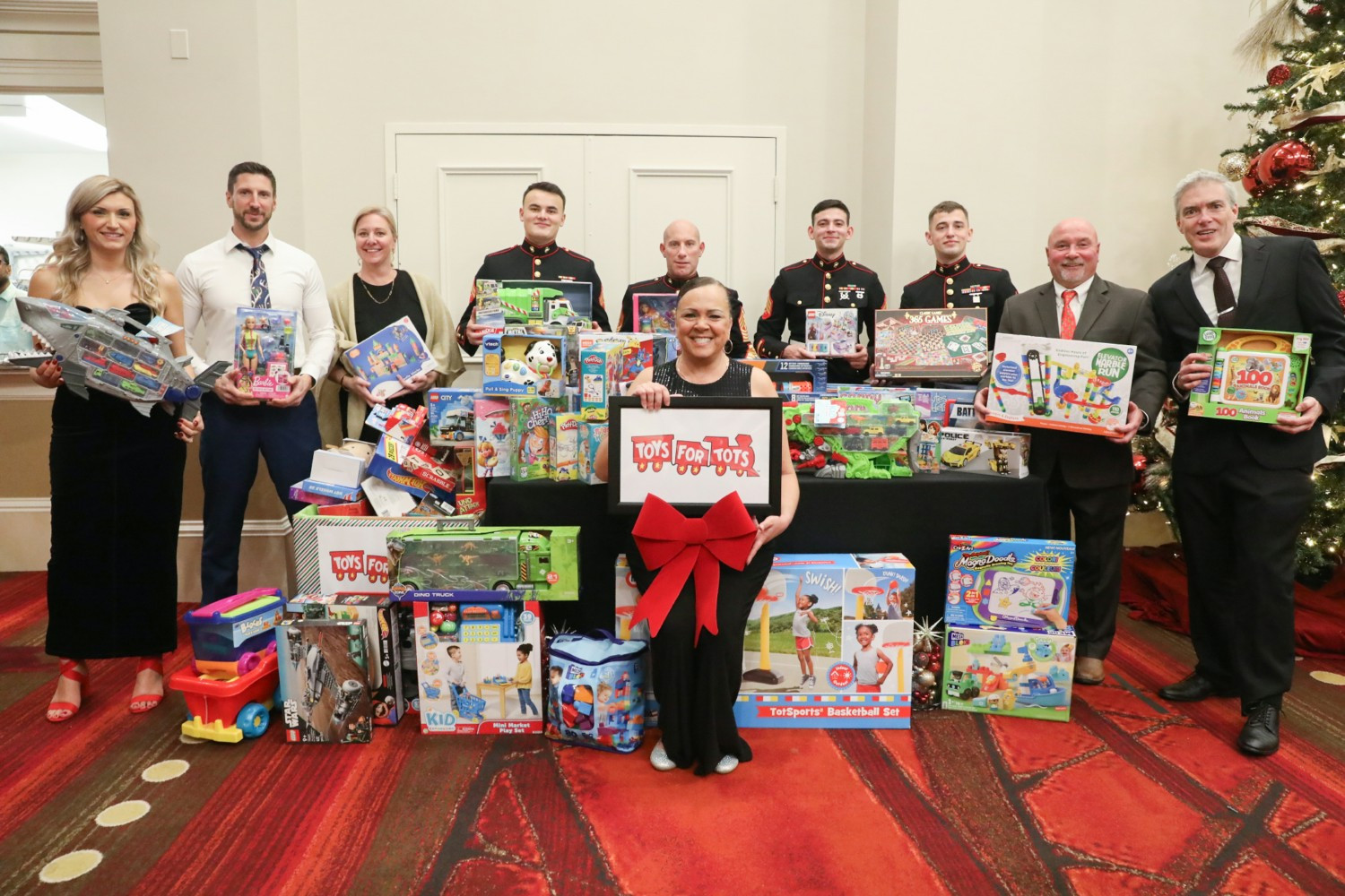 Supporting Toys for Tots at our Holiday Party!