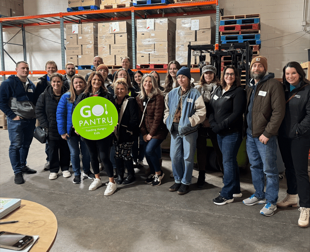 Corporate Marketing team volunteering at the local Go Pantry this past holiday season.