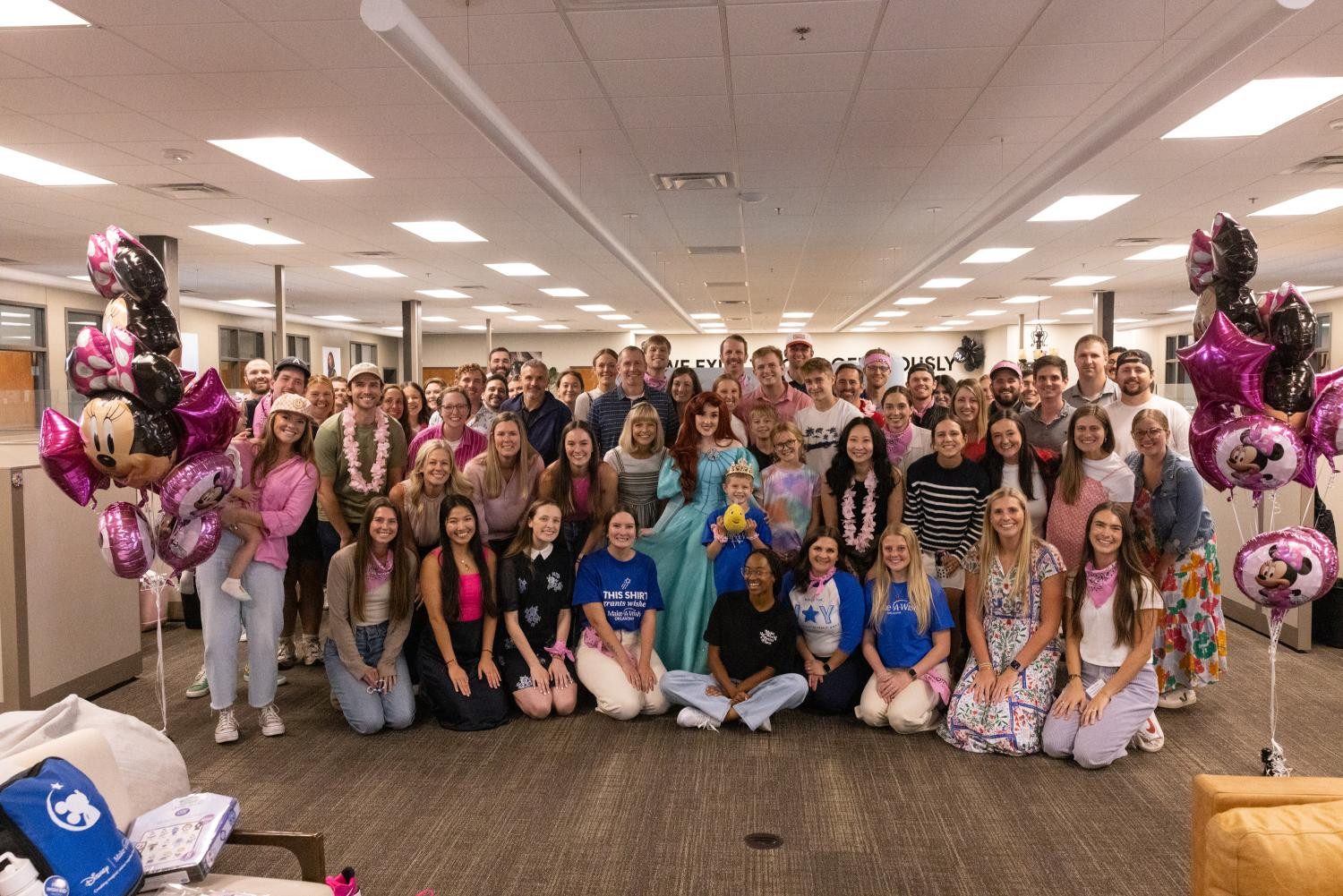 Simple Modern employees with a Make-A-Wish family at a party to kickoff the Make-A-Wish patron's Disney trip.