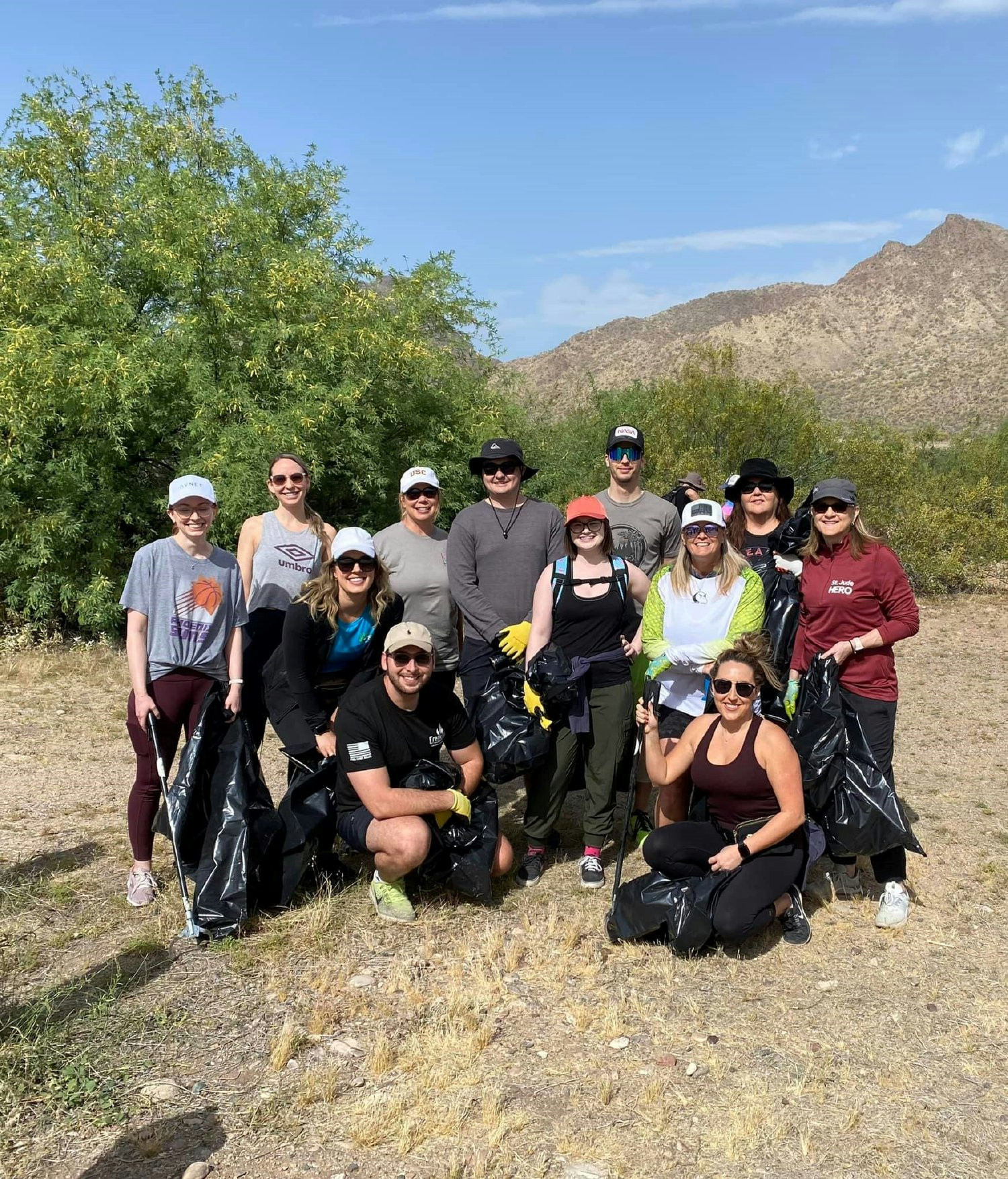 Home office team members using their Cove Cares hours to participate in a trail cleanup hike.