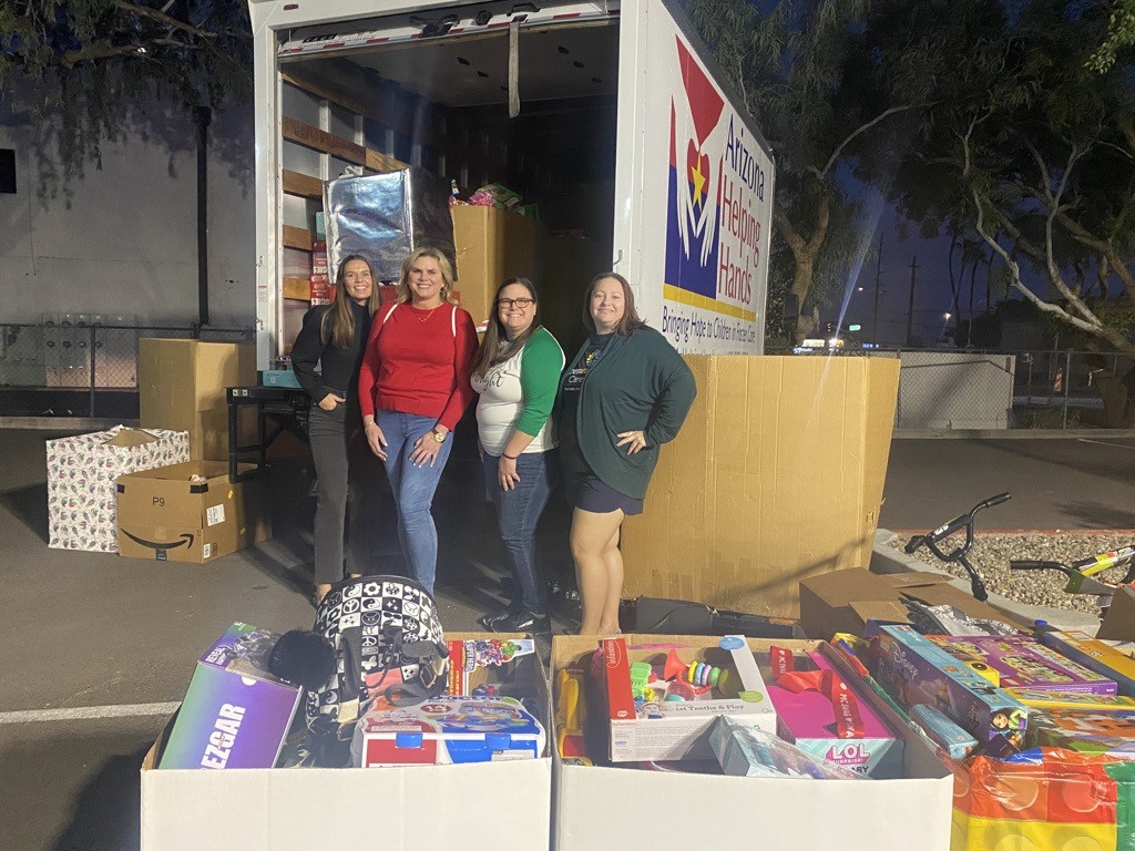 Openforce team members delivering collected donations to AZ Helping Hands to support Arizona foster children. 