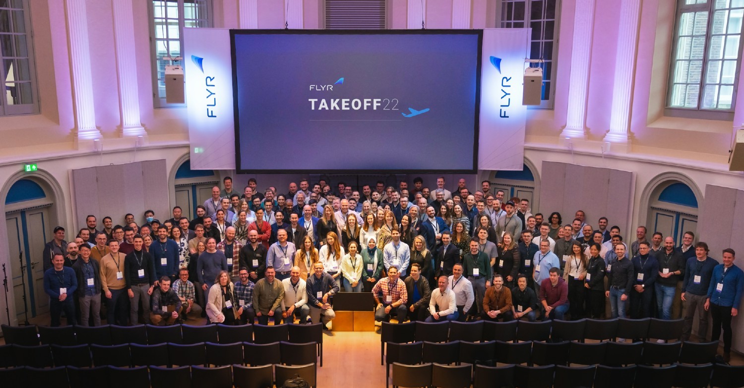 Group photo of attendees at the TakeOff22 all hands conference in Amsterdam 