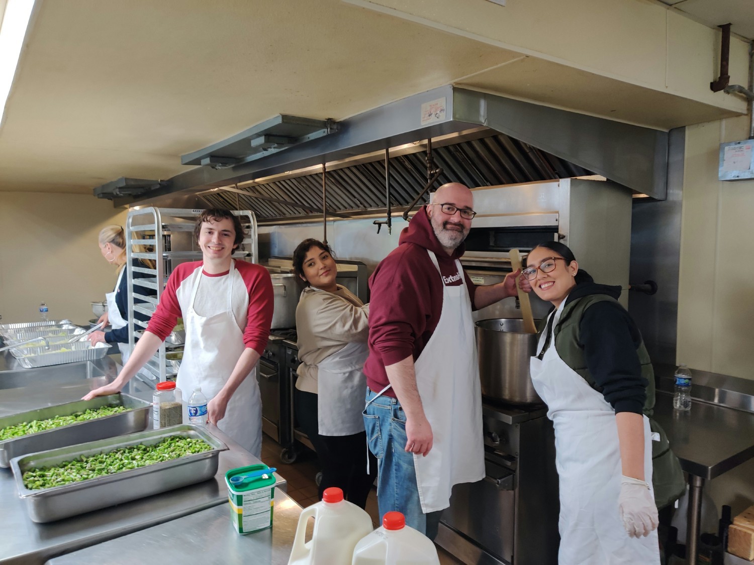 Our staff giving back to the community by preparing meals for over 500 people at a local soup kitchen