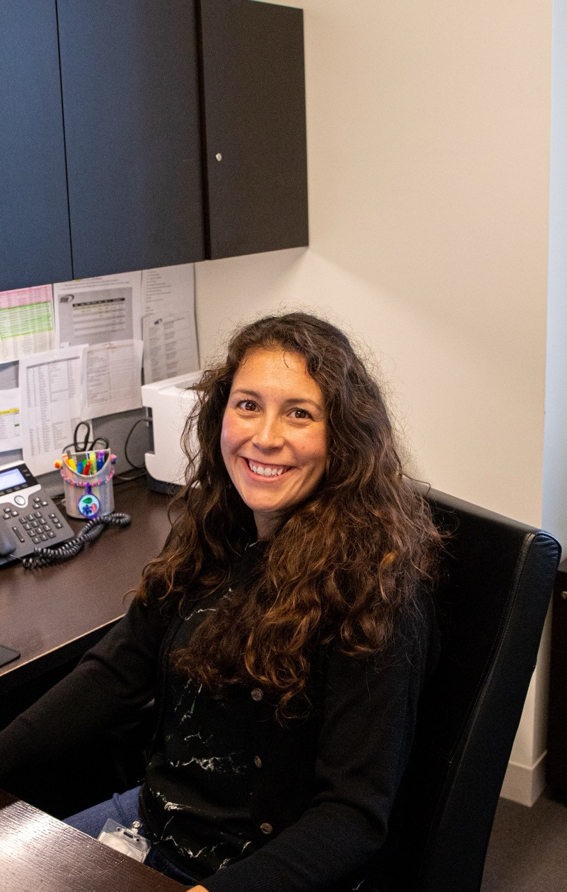 Reyes Holdings employee working in her office space. 
