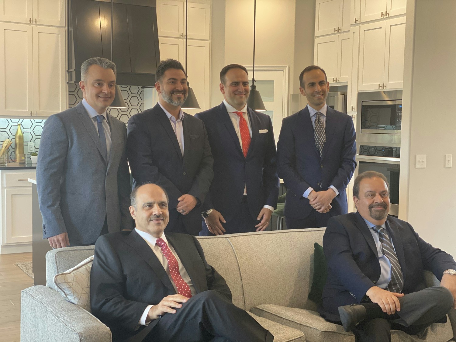 Back Row: MJ, Vahid, Hossein, Ali Farzaneh
Front Row: Jalal and Mohammad Farzaneh, in model home built by Home Creations