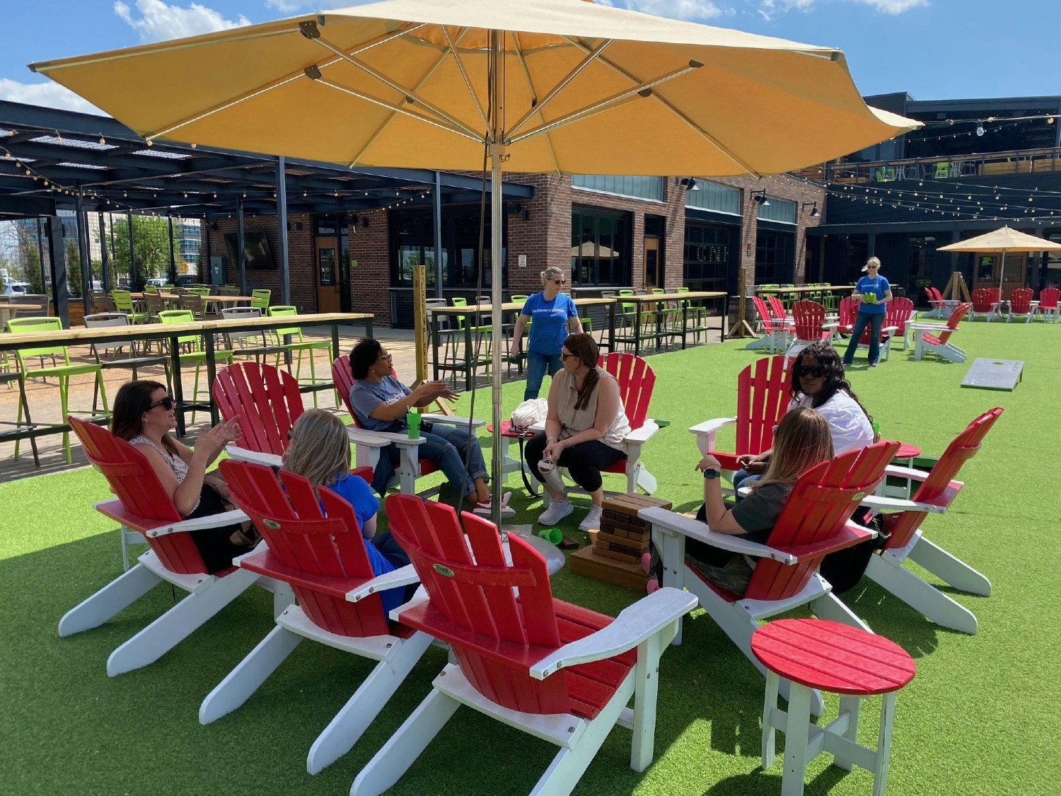 They work hard, and they play hard. Members of Buckner relax after knocking out a few rounds of cornhole.