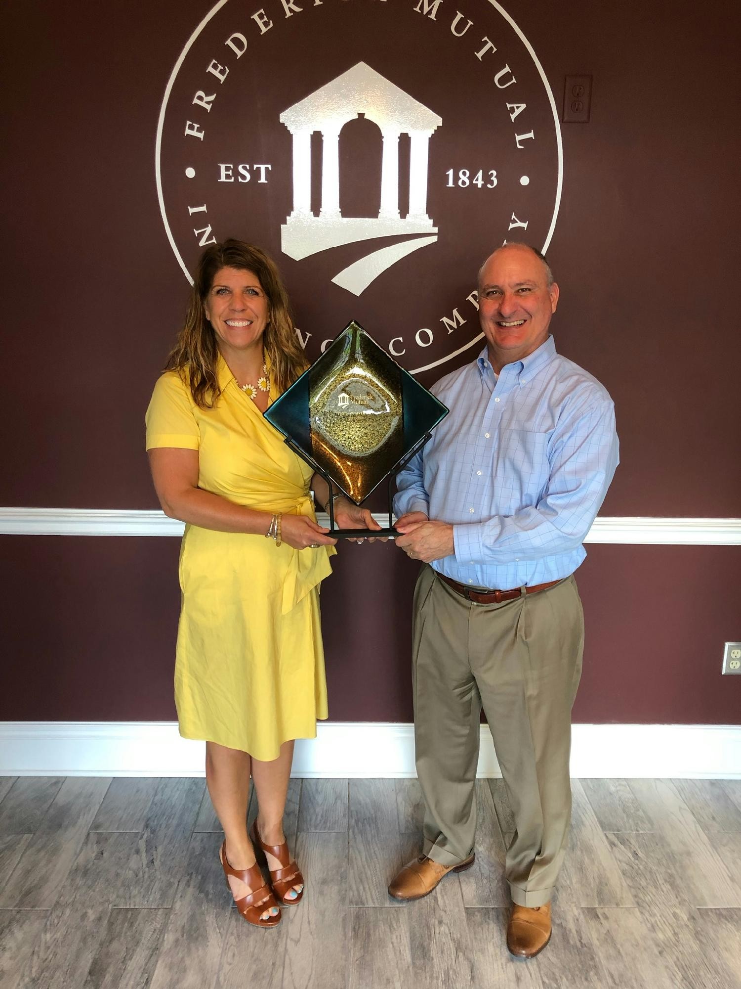 VP & CUO Jill Showalter and VP & CCO Robert Pelletier accepting award. 