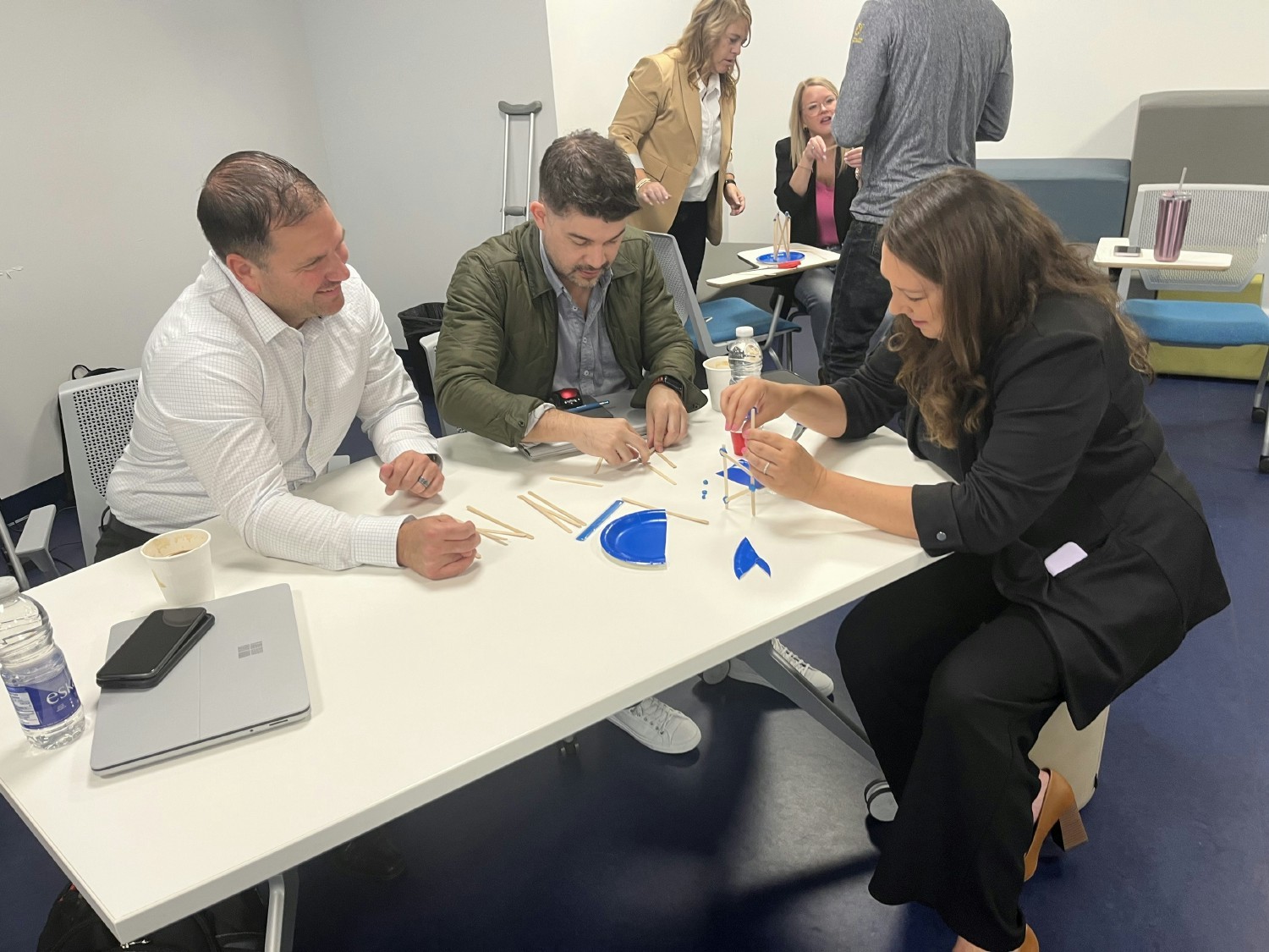 Team building activities contribute to maintaining our culture - hard at work building a dumping bucket replica!