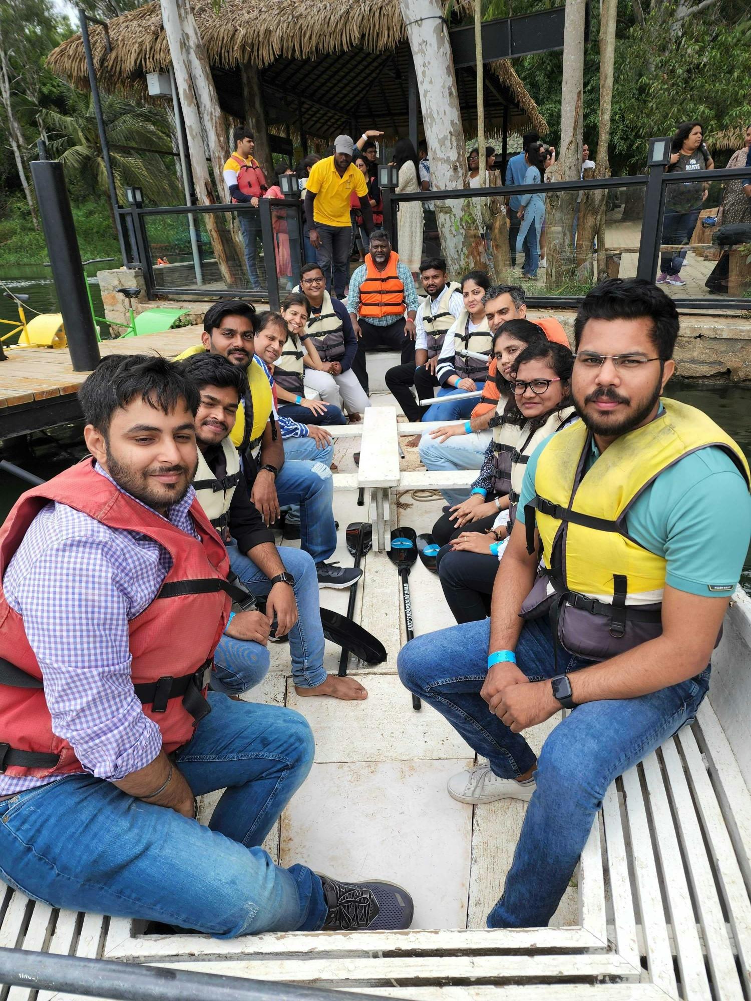 The team takes a river cruise on an outing in Bangalore