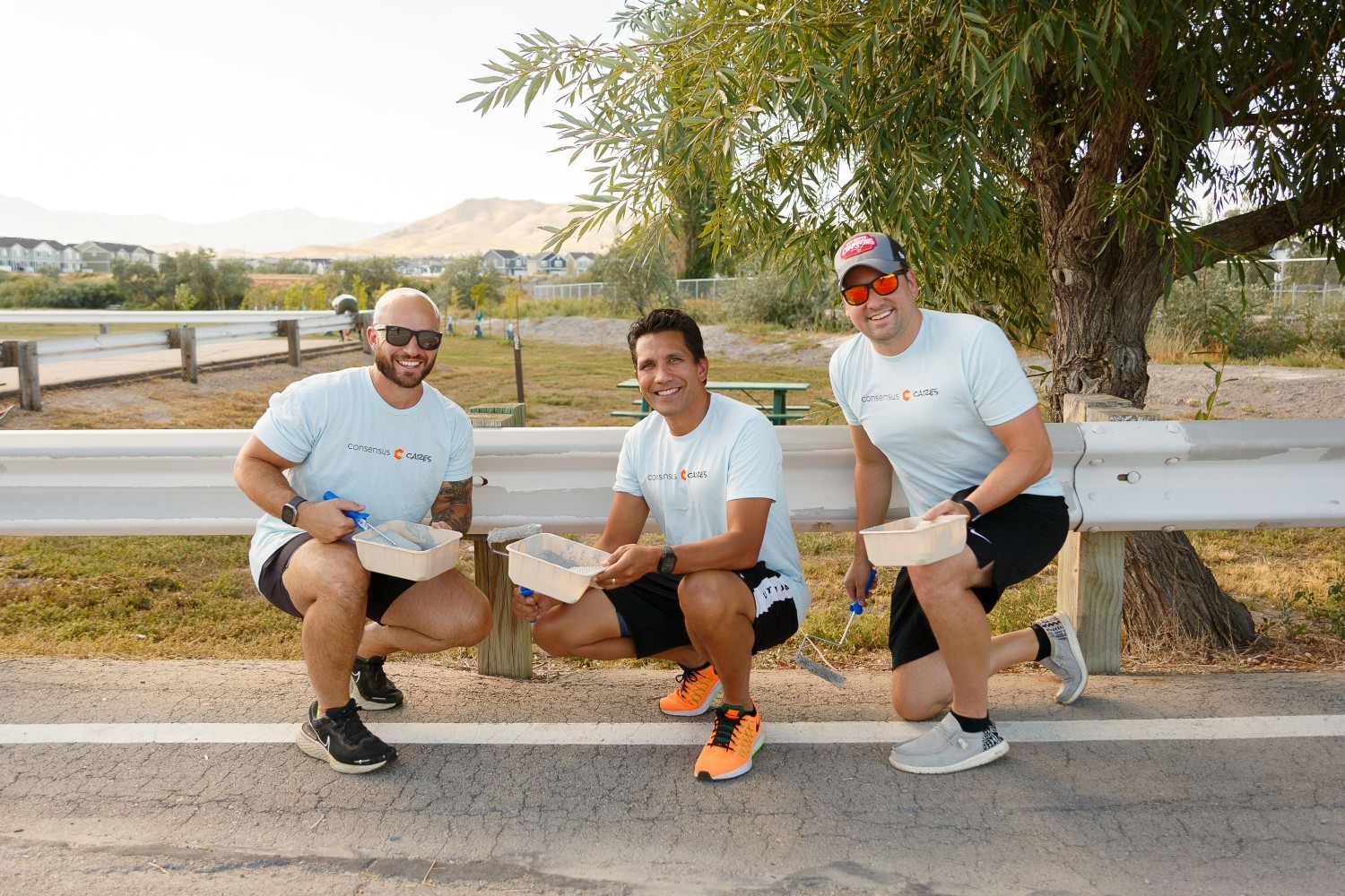 Team members volunteered their time to paint the guard rails at Willow Park.