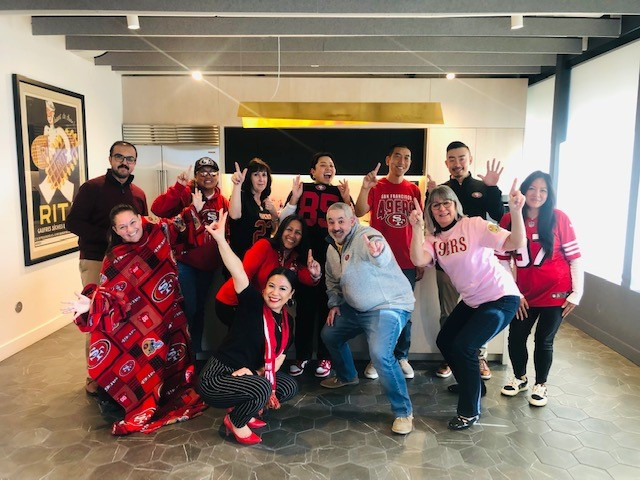 The team showing their spirit and colors on 49ers Day at work!