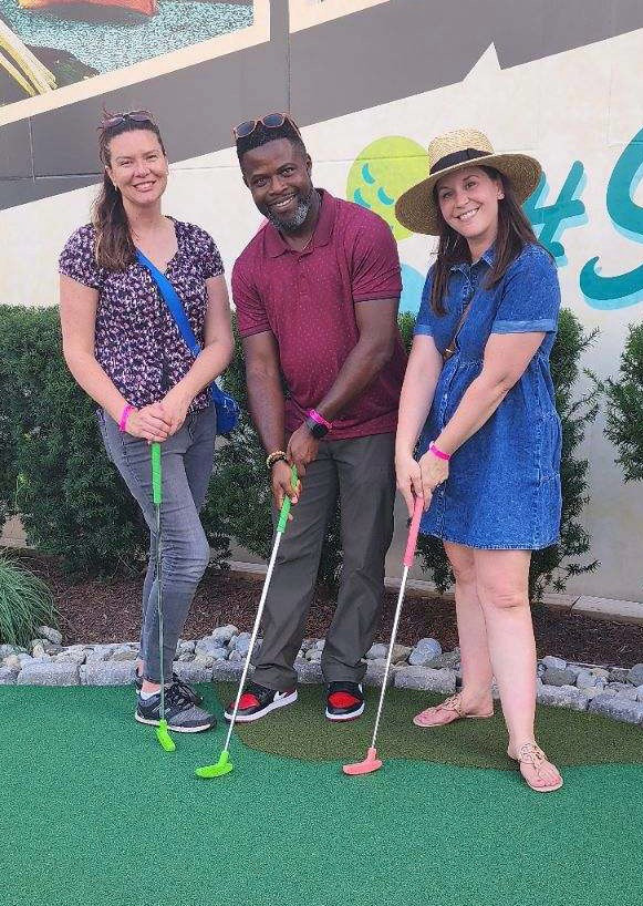 Staff and their families enjoy a fun day of mini golf and great food!