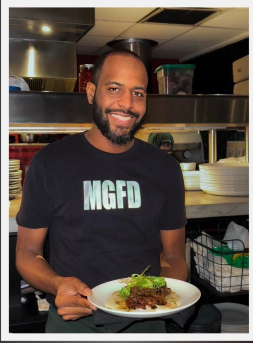 One of our long time team members (who has been with us for over 11 years!) serving up something delicious.