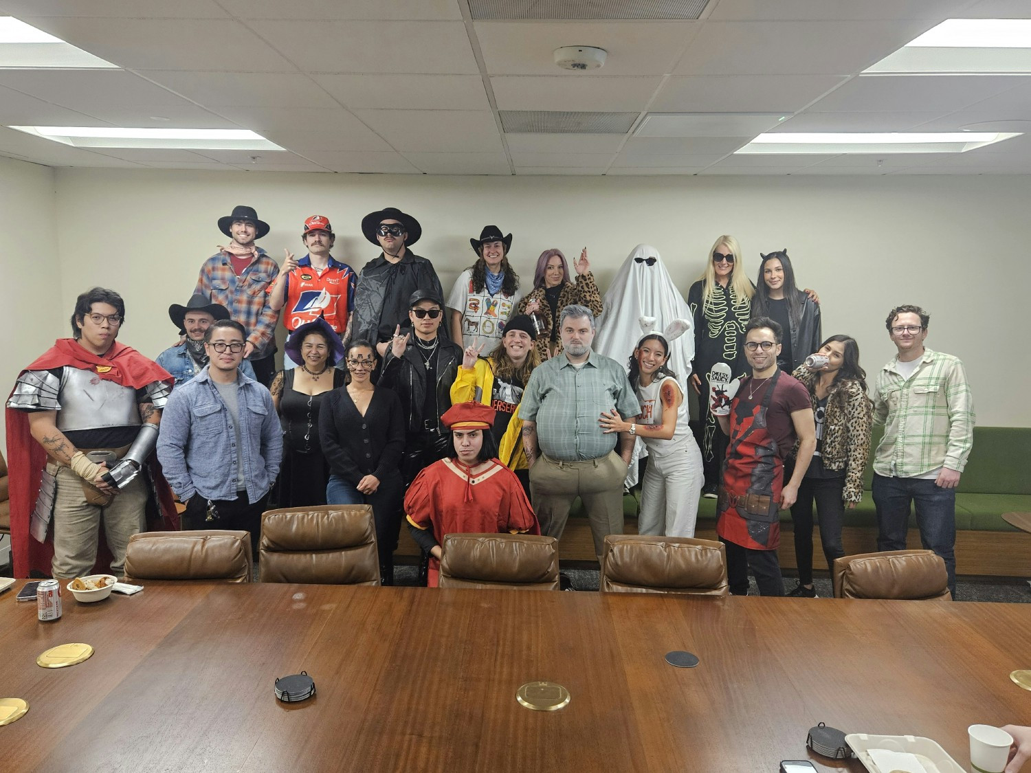 Halloween contest 2024 - we also had a couple of our remote team members participate. Old man in front won!