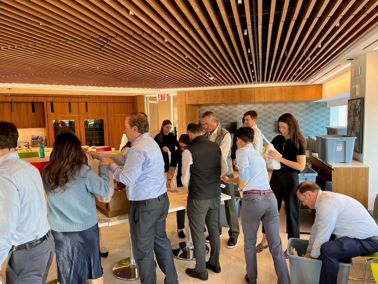 As part of a Giving Back Day, colleagues helping to pack meals for children in need in the local community.