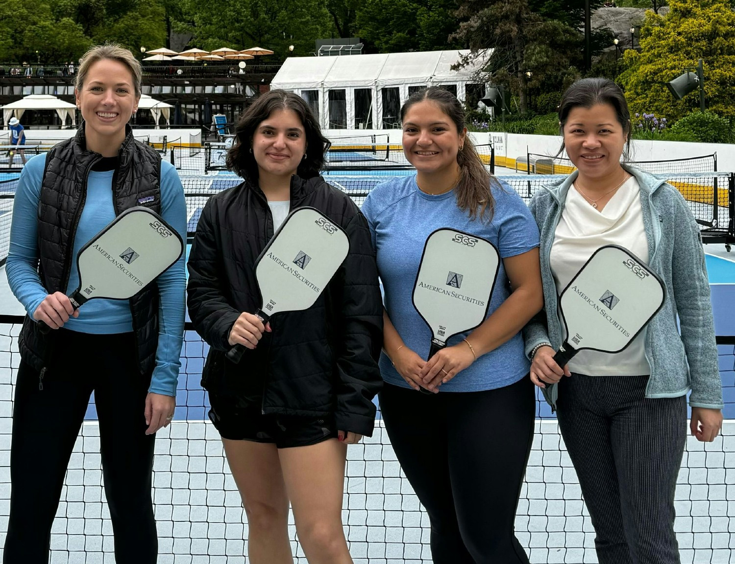 American Securities colleagues playing pickleball as part of a firm league.