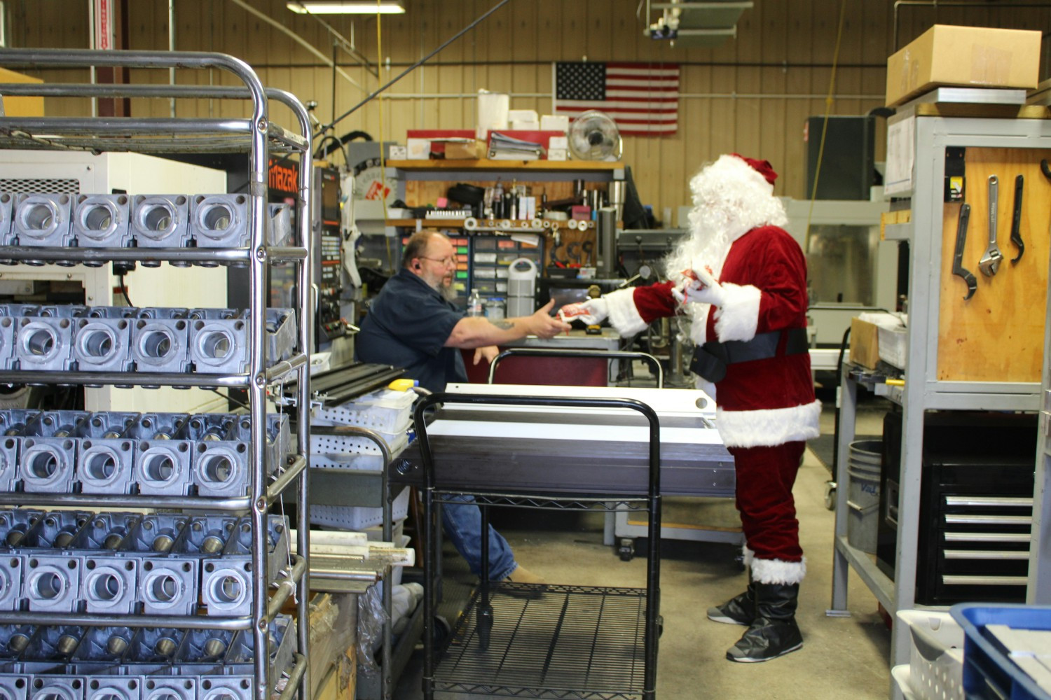 Santa visits the shop! Showing our culture of hard work, teamwork, and a little holiday fun!