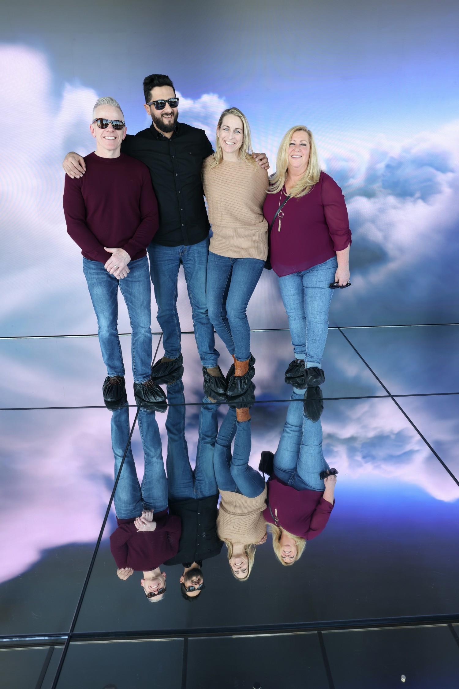 Coface employees pose for a photo at an art exhibit during a special event in New York City.